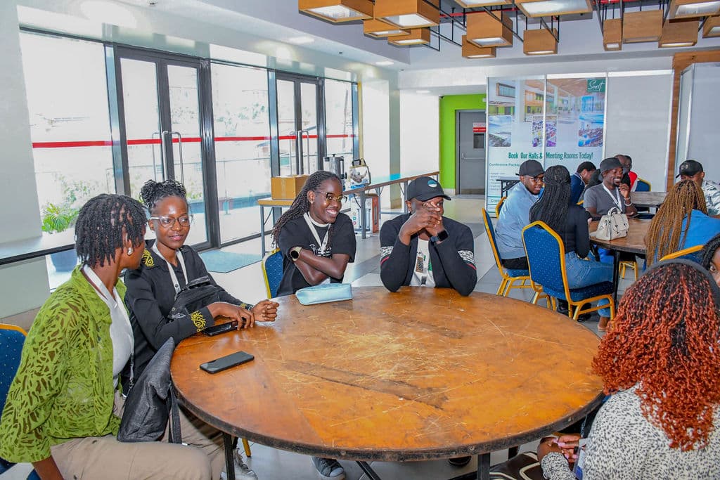 Attendees in conversation around a round table